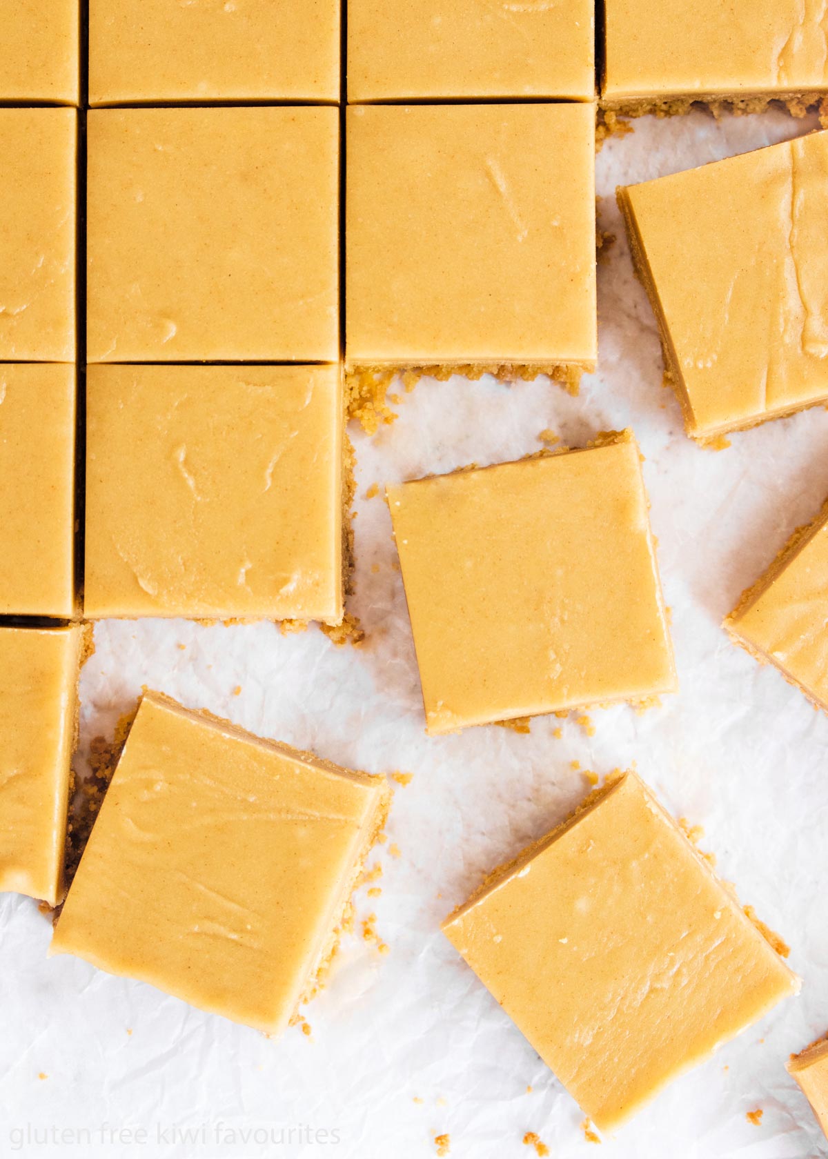 Cut slices of ginger crunch on a piece of baking paper.