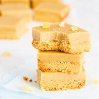 Three stacked pieces of gluten free ginger crunch.