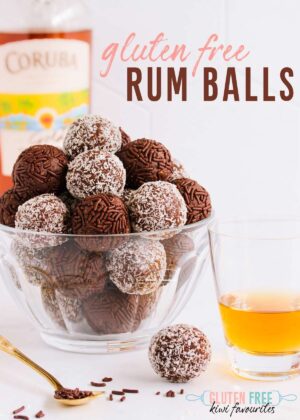 Rum balls in a white bowl with text overlay reading: "Gluten Free Rum Balls".
