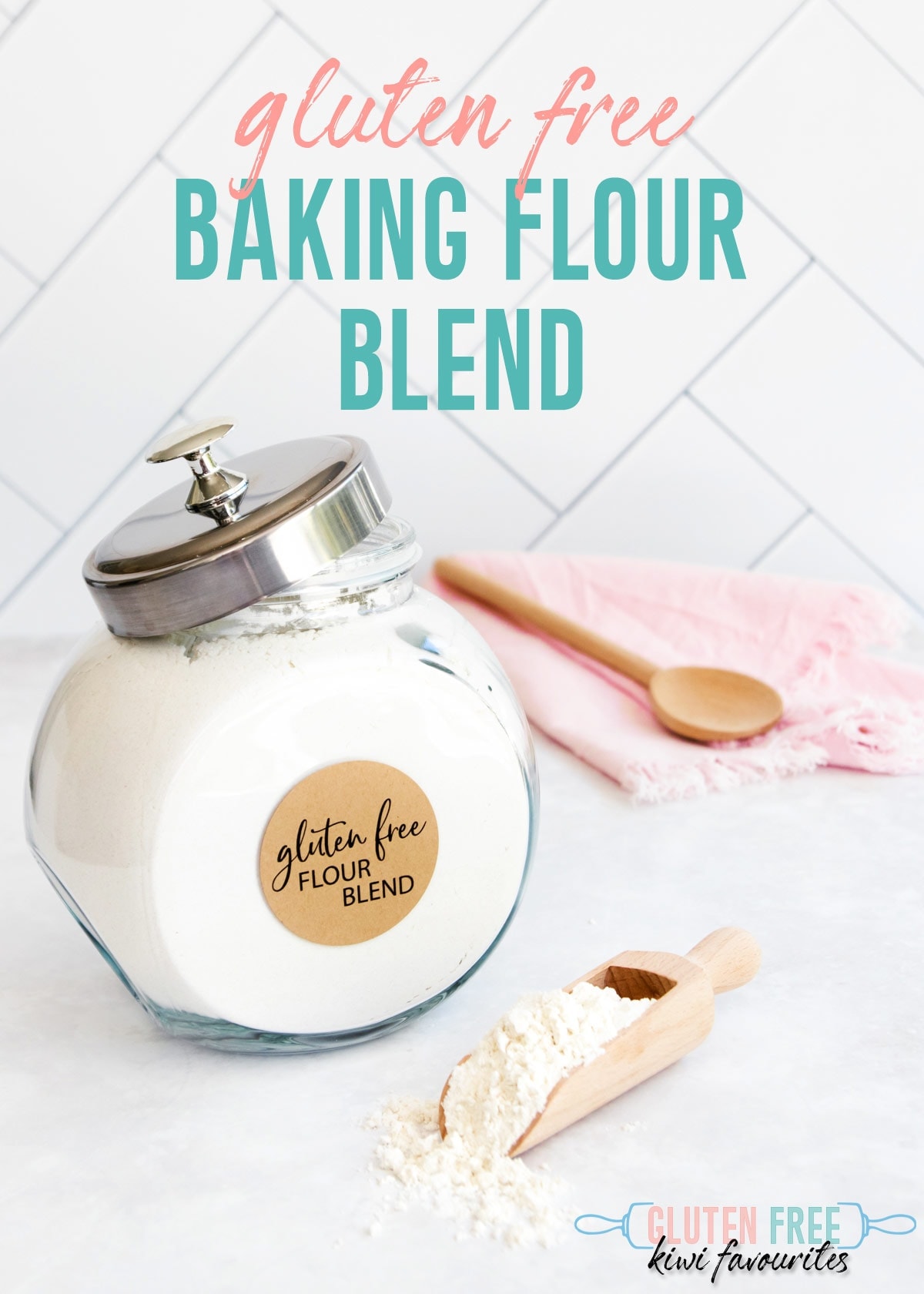 A large jar of flour on a grey background, with a small wooden scoop of flour in front. Text overlay reads: "gluten free baking flour blend".