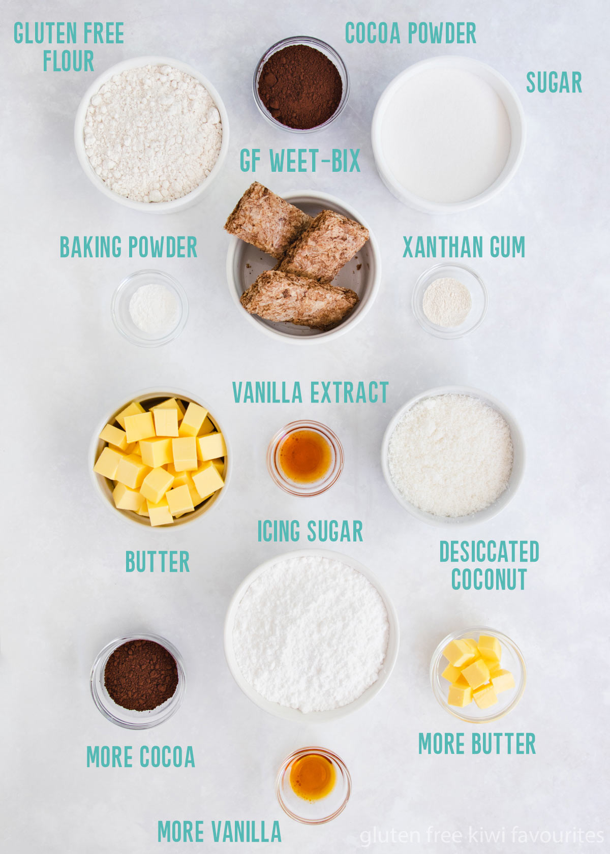 The weetbix slice ingredients in small white bowls on a grey background.