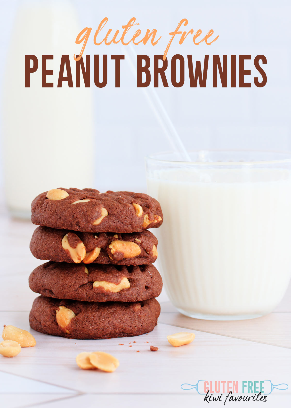 Four stacked biscuits next to a glass of milk with a clear straw, text overlay reads "gluten free peanut brownies".