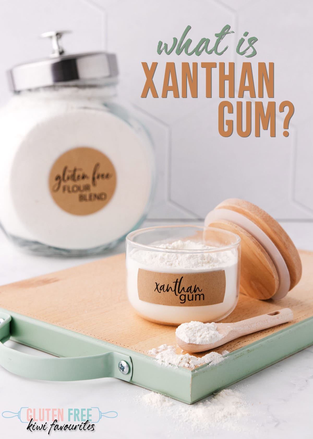 A small jar of xanthan gum, with a jar of gluten free flour in the background, text reads "what is xanthan gum?".