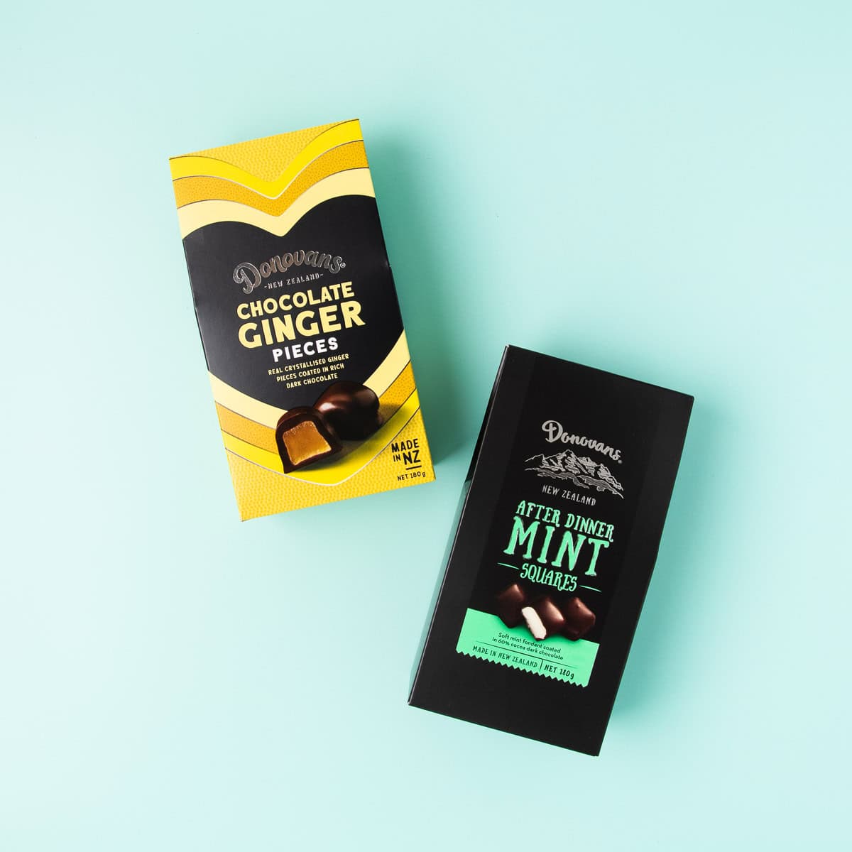 A packet of Donovan's Chocolate Ginger pieces and After Dinner mints, on a mint green background.