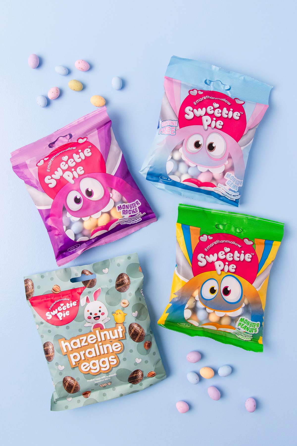 4 packets of Sweetie Pie brand Easter eggs - two packets of pastel mini eggs, one of "Monster peanuts" mini eggs and one of hazelnut praline eggs.