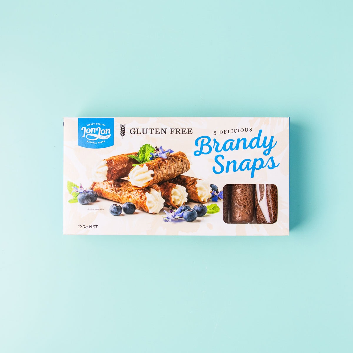 A box of JonJon gluten free brandy snaps on a mint green background.